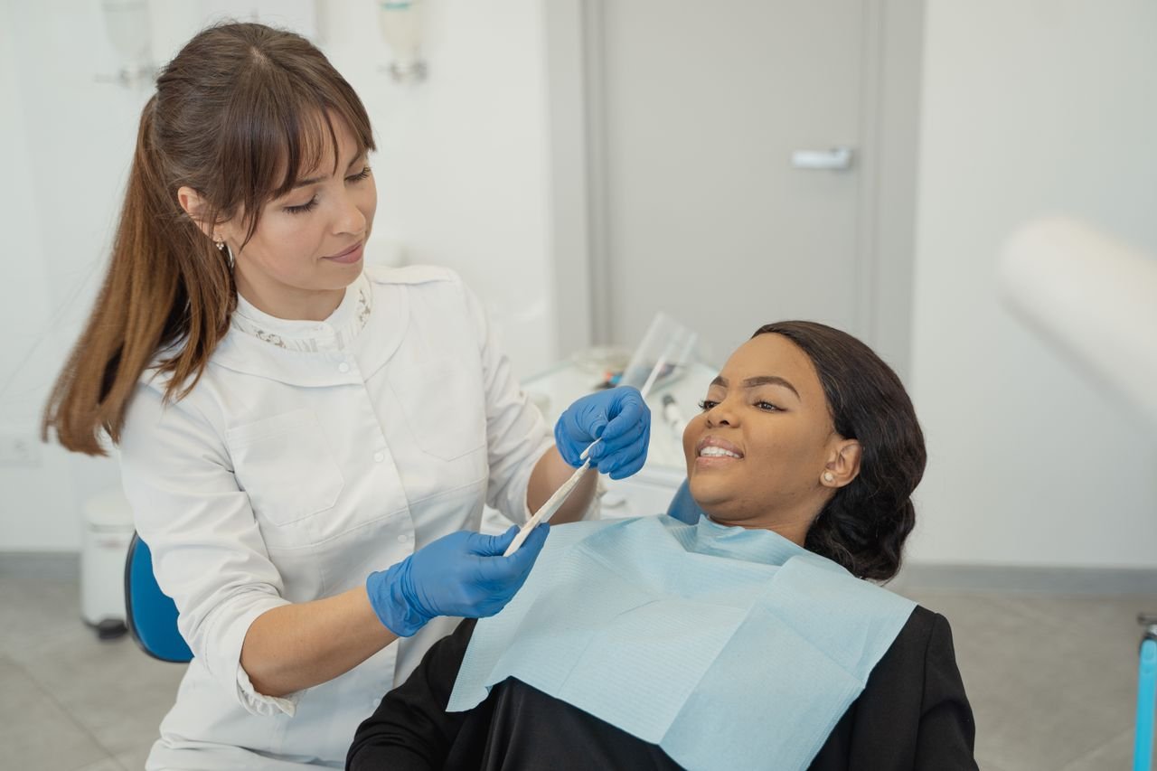 The Art of Drawing Readers In: Your attractive post title goes here A dentist provides care to a patient during a dental checkup in a clinic setting.